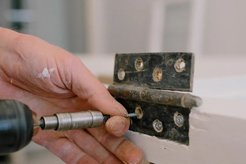 Removing an old worn hinge from an interior door frame